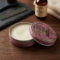 Reuzel Pink Pomade Grease - open potje met zichtbare inhoud en textuur